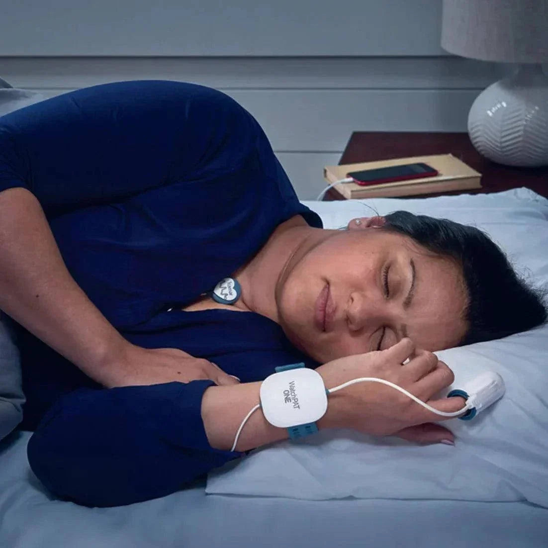 WatchPAT ONE home sleep testing device worn on wrist with finger probe for sleep apnea analysis